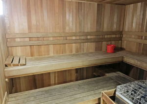 sauna steam room with wooden bench to sit